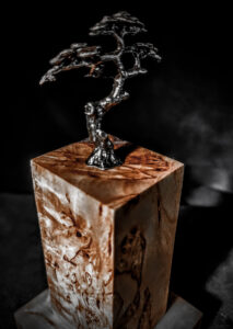 Handcrafted wooden keepsake urn made of Karelian Birch Burl Wood, a unique and elegant choice for preserving the ashes of your loved ones as a cherished keepsake.