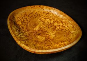 Close-up view of a handcrafted Karelian Birch Burl Wood Decorative Bowl, showcasing its captivating natural patterns and wood grains.