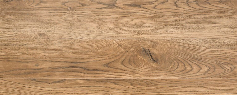 A close-up view of finely crafted oak wood, showcasing its rich grain pattern and warm, golden hues. The intricate details highlight the wood's natural beauty, symbolizing strength and enduring elegance. Suitable for furniture, flooring, and construction projects, oak wood reflects the timeless allure of this resilient and versatile hardwood.