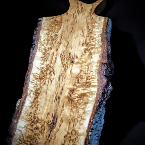 Handcrafted unique Karelian Birch Burl cutting board."